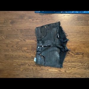 Women’s Levi’s black jean shorts.